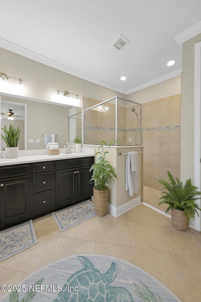 2790 Las Calinas Blvd, Saint Augustine, FL 32095 - bathroom featuring vanity, walk in shower, crown molding, tile patterned floors, and a ceiling fan