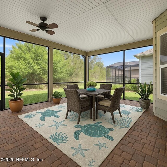 2790 Las Calinas Blvd, Saint Augustine, FL 32095 - sunroom with ceiling fan and outdoor dining area