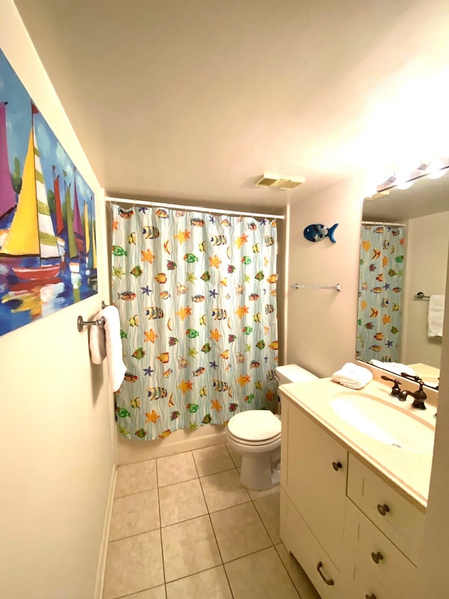 full bathroom featuring tile patterned floors, shower / bathtub combination with curtain, vanity, and toilet