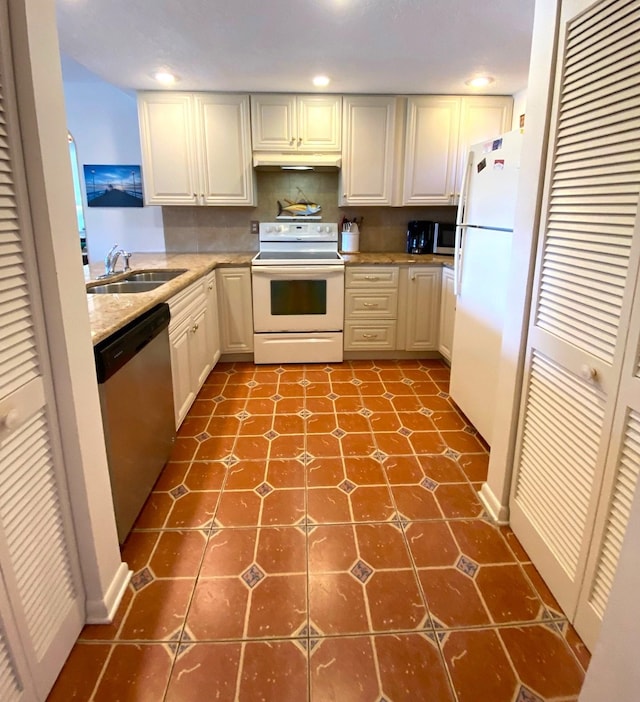 kitchen featuring sink, light tile patterned floors, and stainless steel appliances