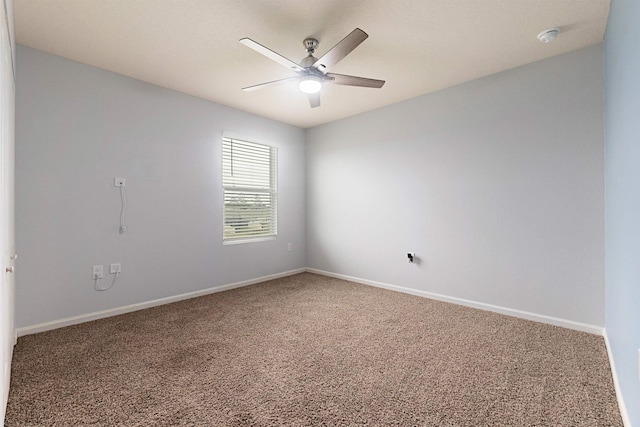 unfurnished room featuring a ceiling fan, carpet flooring, and baseboards