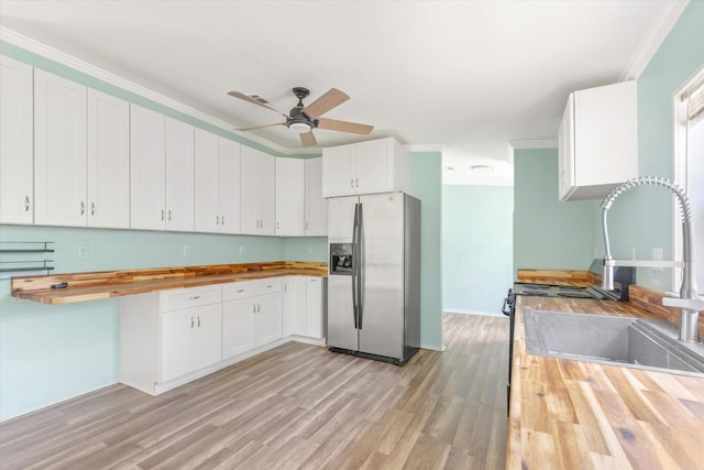 10160 Ebert Ave, Hastings, FL 32145 - kitchen with wooden counters, stainless steel refrigerator with ice dispenser, a sink, a ceiling fan, and light wood-type flooring