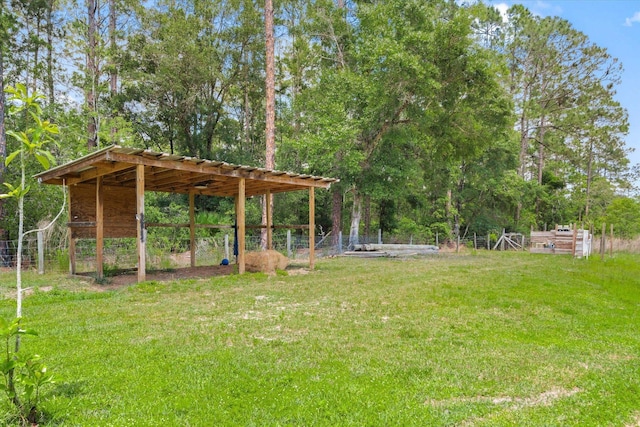 10160 Ebert Ave, Hastings, FL 32145 - view of grassy yard with view of wooded area and an outbuilding