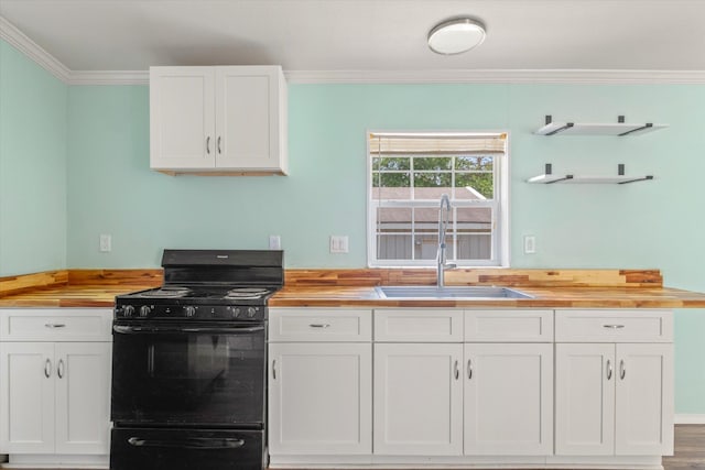 10160 Ebert Ave, Hastings, FL 32145 - kitchen featuring gas stove, butcher block counters, a sink, ornamental molding, and white cabinets