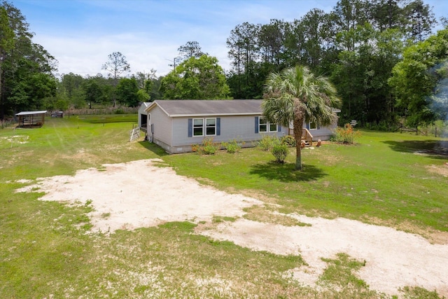10160 Ebert Ave, Hastings, FL 32145 - view of front of home with a front yard and driveway