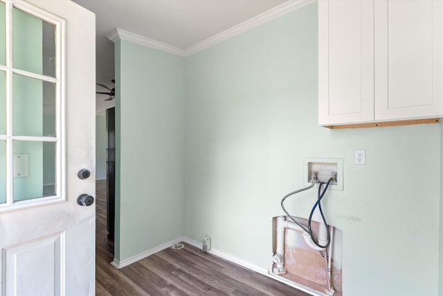 10160 Ebert Ave, Hastings, FL 32145 - washroom with cabinet space, hookup for a washing machine, crown molding, dark wood-type flooring, and baseboards