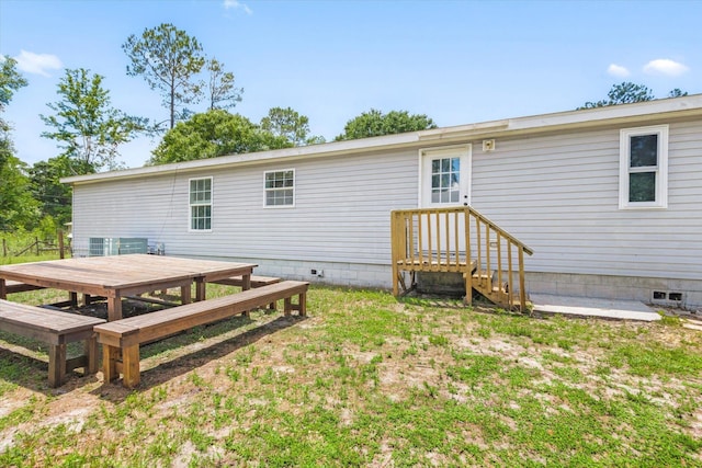 10160 Ebert Ave, Hastings, FL 32145 - rear view of house featuring crawl space and outdoor dining space