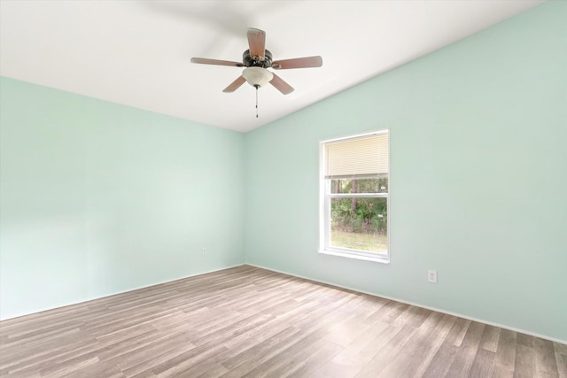 10160 Ebert Ave, Hastings, FL 32145 - spare room featuring vaulted ceiling, wood finished floors, and ceiling fan