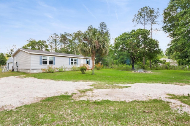 10160 Ebert Ave, Hastings, FL 32145 - back of house featuring a yard, a garage, and crawl space