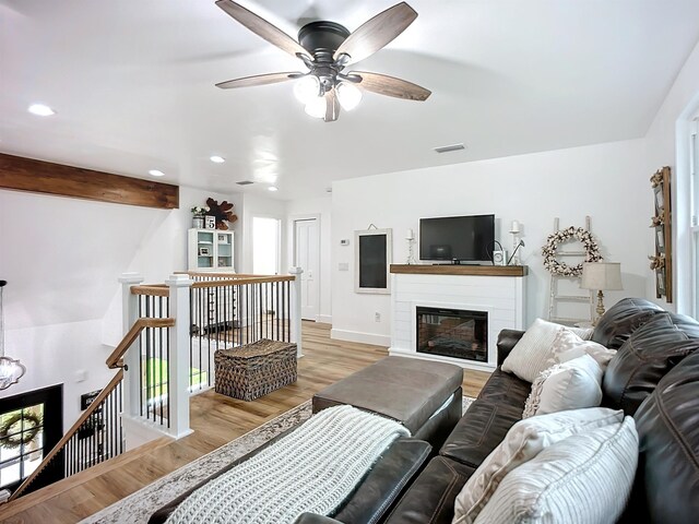 8975 Reid Packing House Rd, Hastings, FL 32145 - living area featuring a ceiling fan, light wood-type flooring, recessed lighting, and a glass covered fireplace