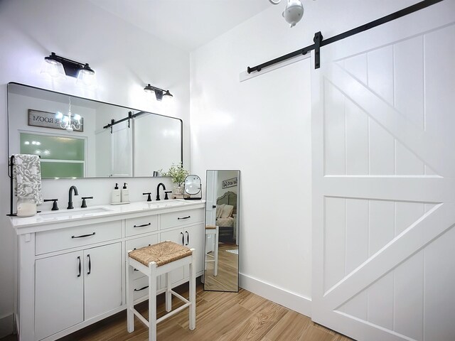 8975 Reid Packing House Rd, Hastings, FL 32145 - bathroom featuring wood finished floors and double vanity