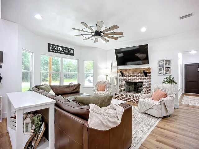 8975 Reid Packing House Rd, Hastings, FL 32145 - living room with a ceiling fan, healthy amount of natural light, wood finished floors, recessed lighting, and a fireplace