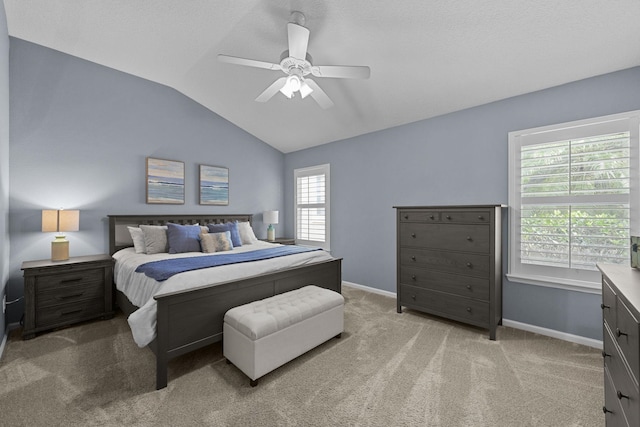 bedroom with lofted ceiling, light carpet, and ceiling fan