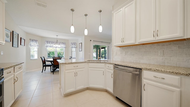 kitchen with dishwasher, hanging light fixtures, light stone counters, backsplash, and white cabinets