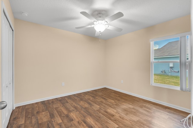 empty room with wood-type flooring and ceiling fan