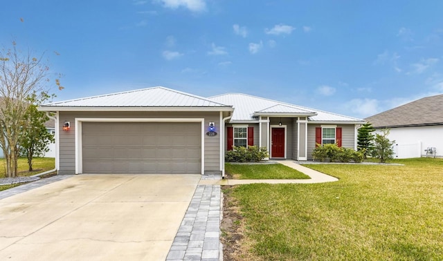 view of front facade with a garage and a front yard