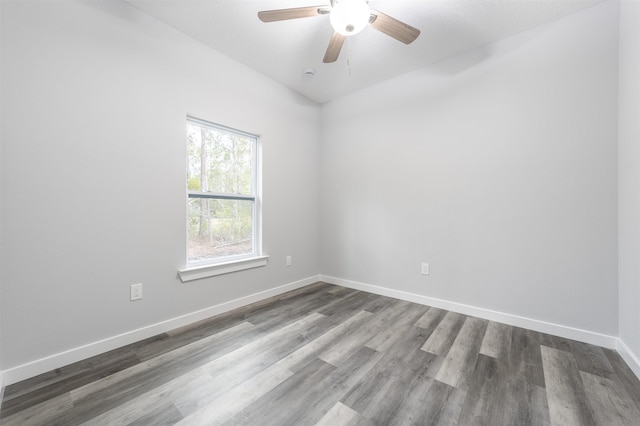 spare room with hardwood / wood-style flooring and ceiling fan