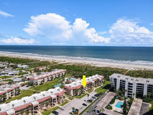 aerial view featuring a view of the beach and a water view