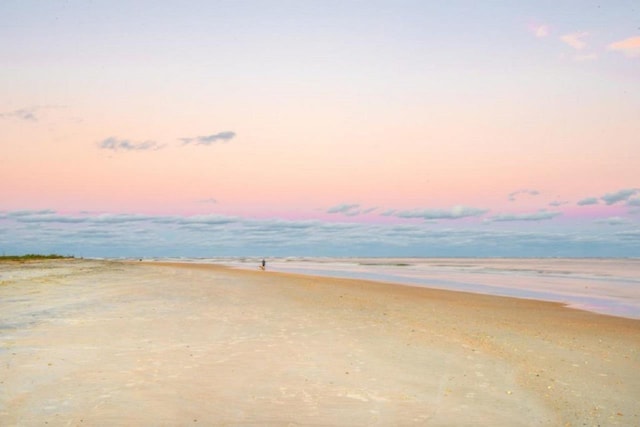 property view of water featuring a beach view