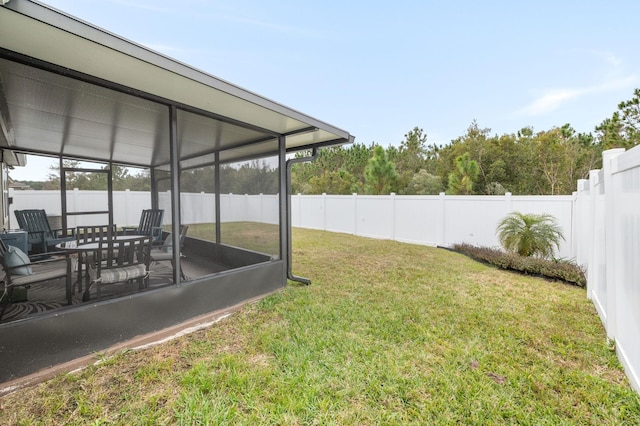 view of yard featuring a sunroom