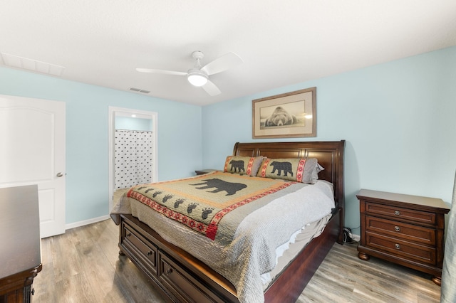 bedroom featuring ceiling fan and light hardwood / wood-style flooring