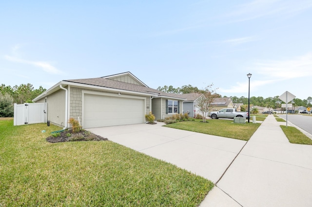 single story home with a garage and a front lawn