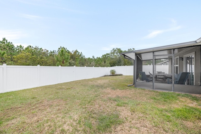 view of yard with a sunroom