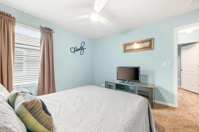 bedroom with light carpet and ceiling fan