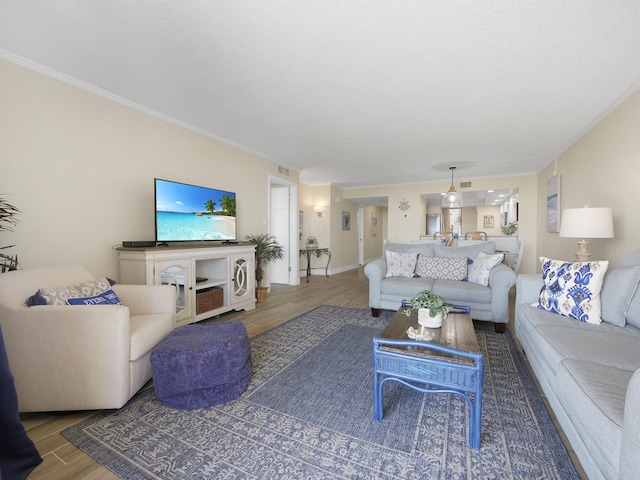 6240 A1A S Unit 103, Saint Augustine, FL 32080 - living area featuring baseboards, ornamental molding, and wood finished floors