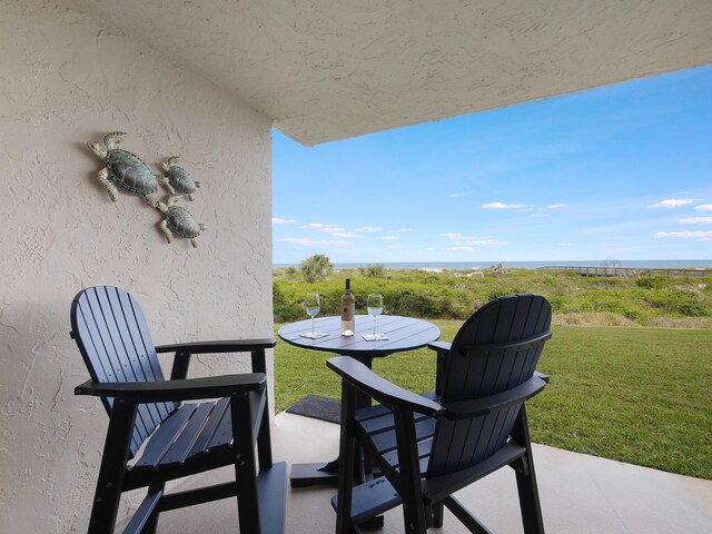 6240 A1A S Unit 103, Saint Augustine, FL 32080 - balcony featuring outdoor dining space and a patio area