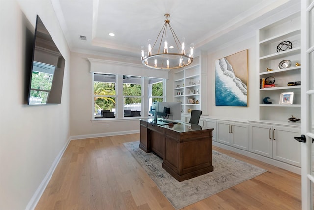 office area featuring ornamental molding, a chandelier, built in features, and light hardwood / wood-style flooring