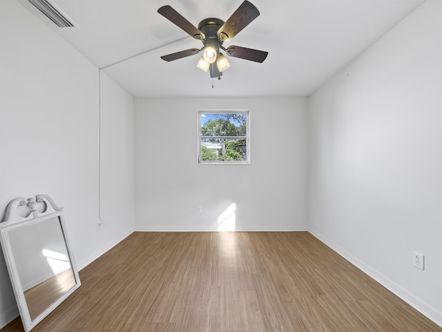 empty room featuring ceiling fan and wood-type flooring