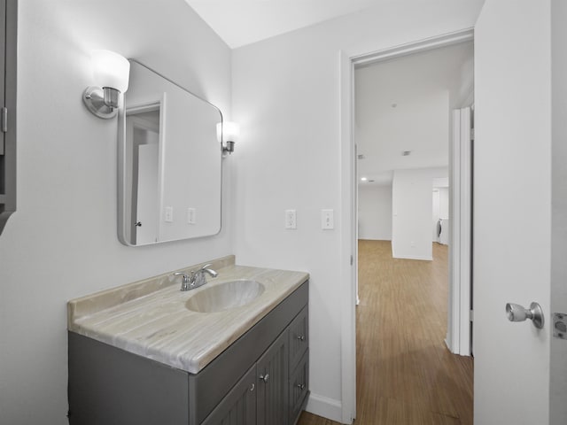 bathroom featuring hardwood / wood-style flooring and vanity