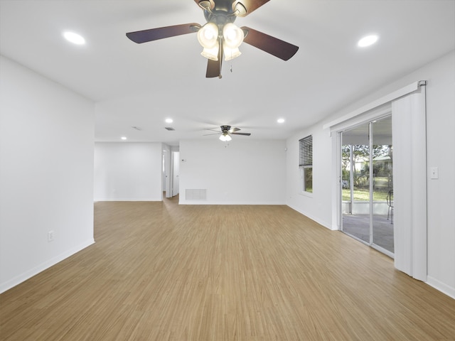 unfurnished living room with ceiling fan and light hardwood / wood-style flooring