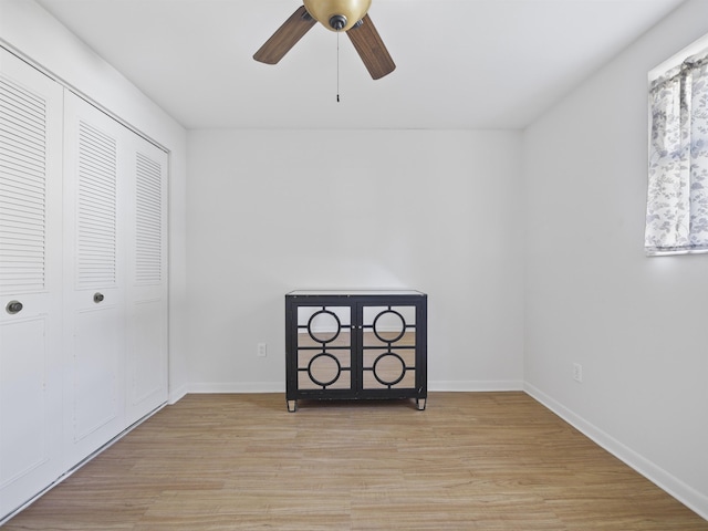 unfurnished bedroom with a closet, ceiling fan, and light hardwood / wood-style flooring