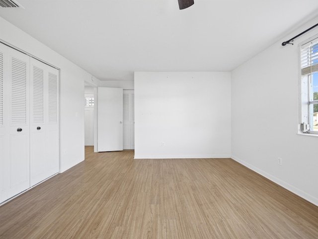 unfurnished bedroom with light wood-type flooring