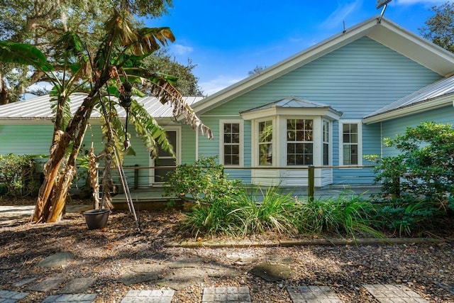 view of property exterior with metal roof