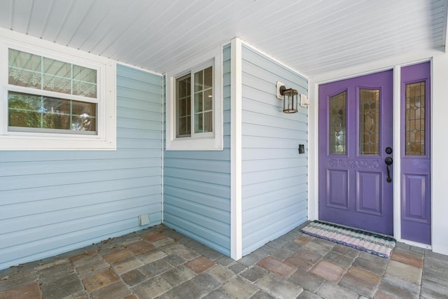 doorway to property featuring covered porch