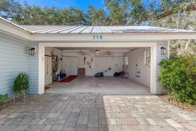 garage featuring decorative driveway