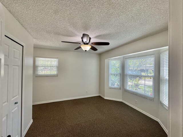 view of patio with outdoor dining area and a ceiling fan