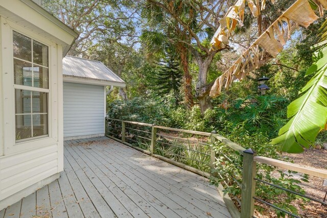 garage featuring electric panel, heating unit, a garage door opener, and water heater