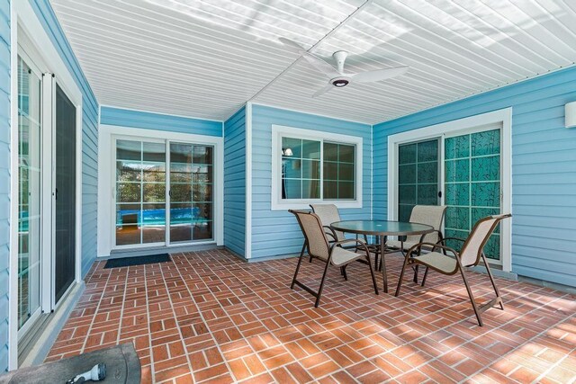 pool featuring a lanai and a patio