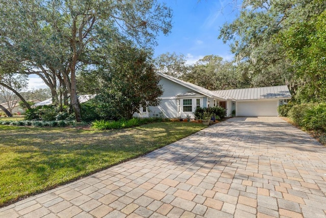 ranch-style home with a garage and a front yard