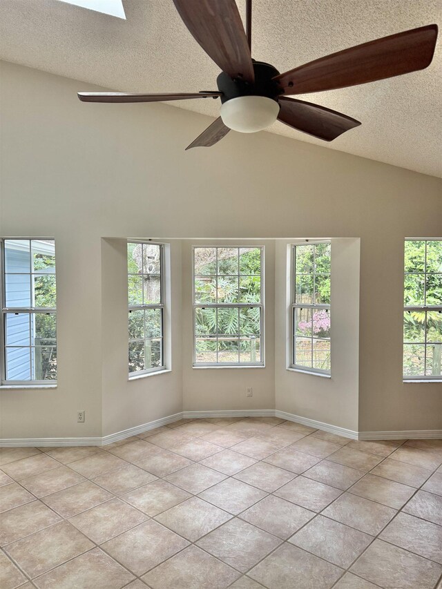 doorway to outside featuring light tile patterned floors, baseboards, and arched walkways