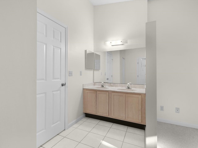 bathroom with tile patterned floors and vanity