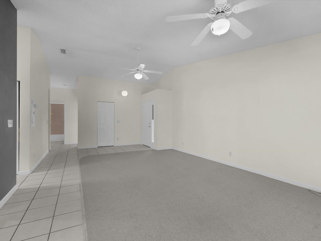 tiled empty room featuring ceiling fan