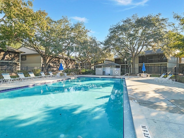 view of swimming pool featuring a patio area