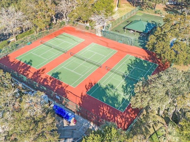 view of tennis court with basketball hoop