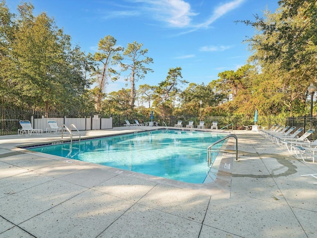 view of swimming pool with a patio