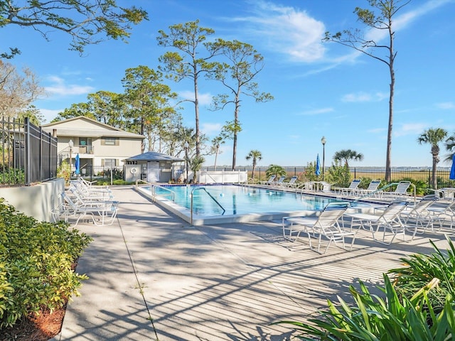 view of swimming pool featuring a patio area